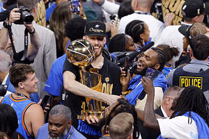 Chet Holmgren's teammates save the Larry O'Brien trophy from damage as center staggers drunkenly on stage